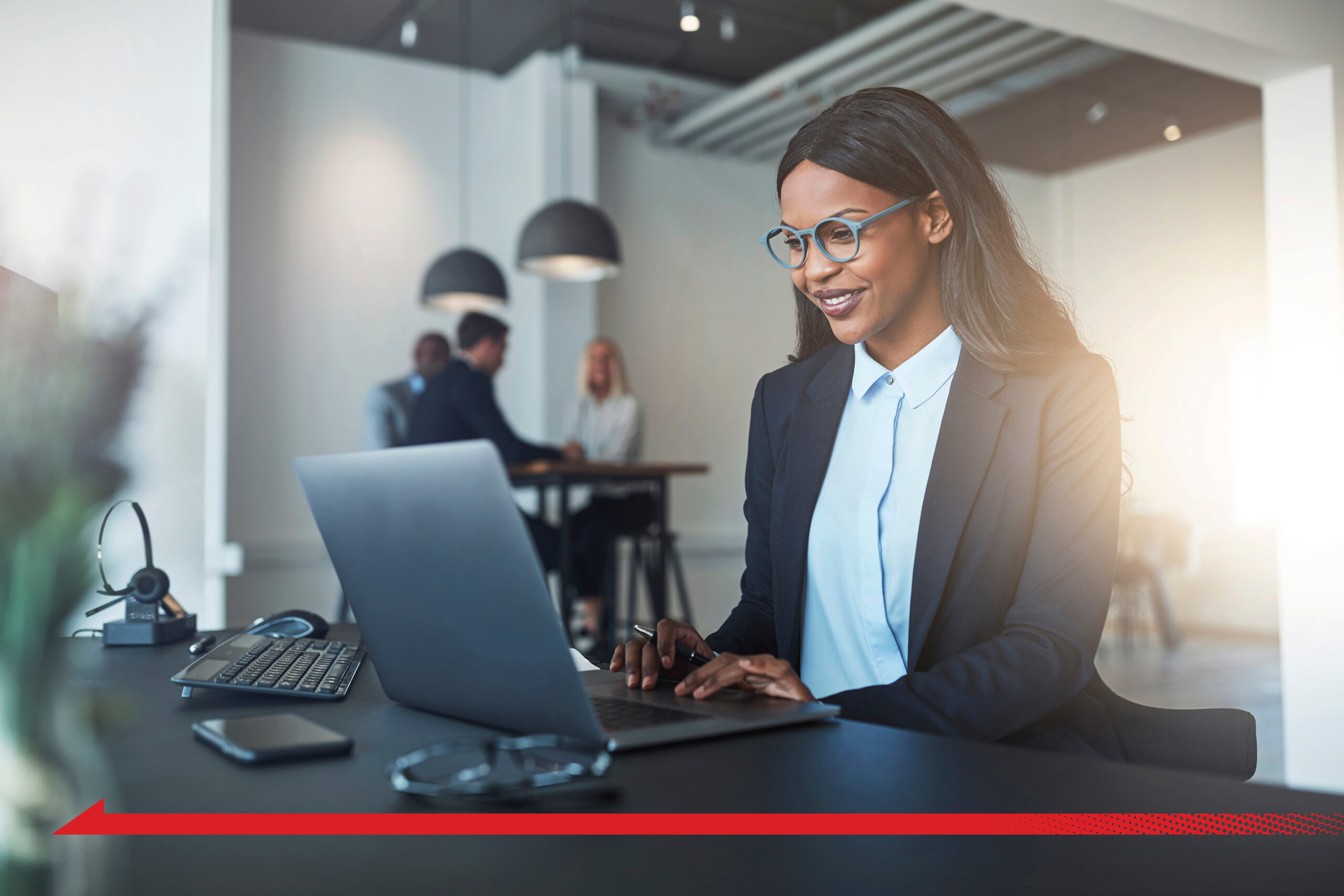 Young black woman working on a computer red arrow insider risk management